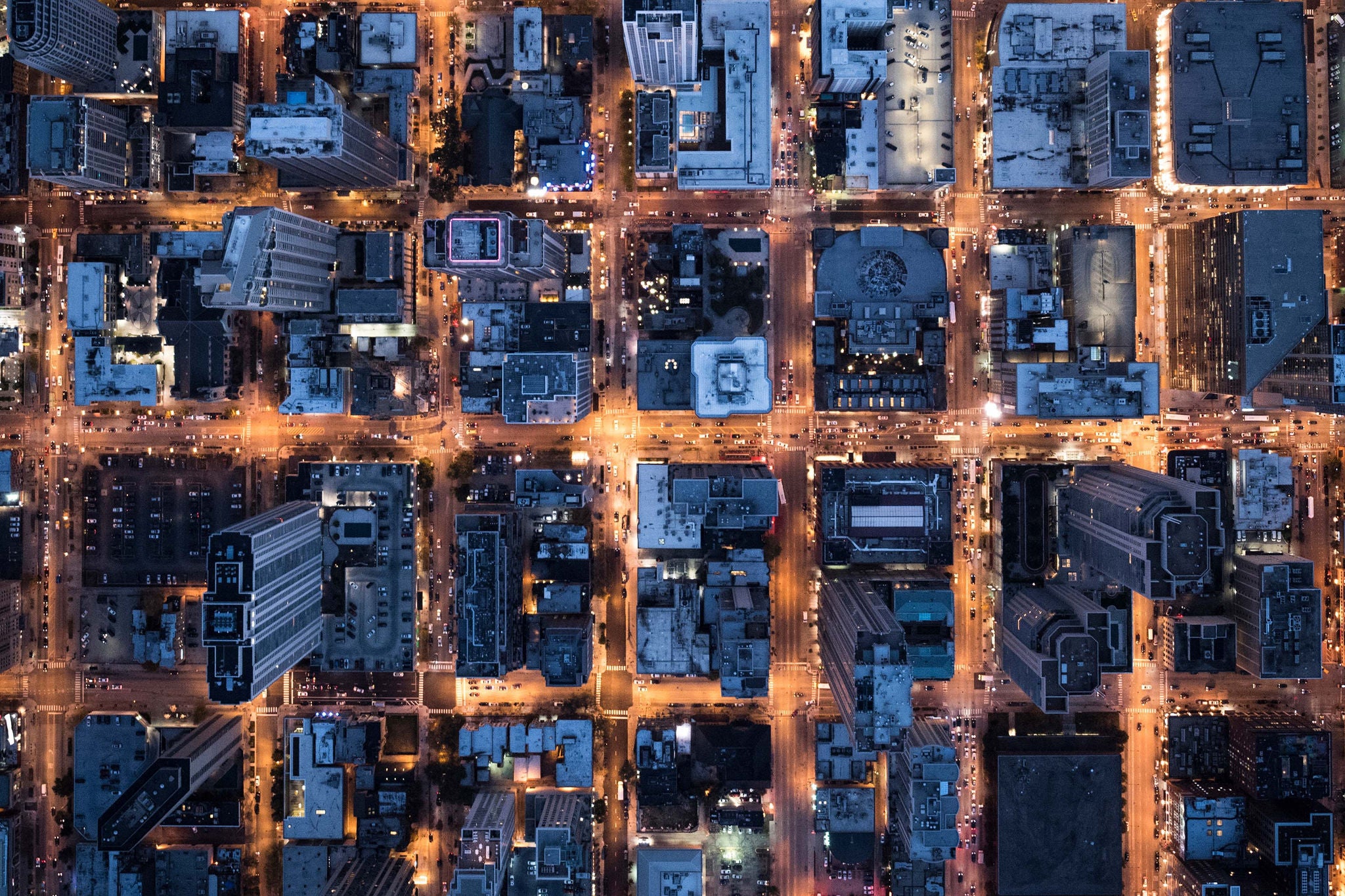 An aerial image of the downtown of Chicago with building illumination at dusk
