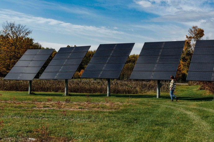 Women standing near solar panels